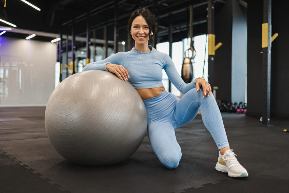 How do you remove the plug from an exercise ball?